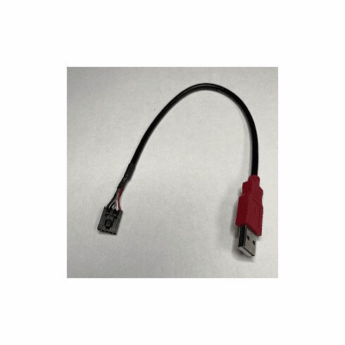 A red and black cable is connected to the side of a wall.