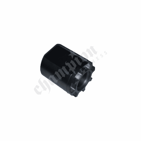 A black plastic part that is sitting on the ground.