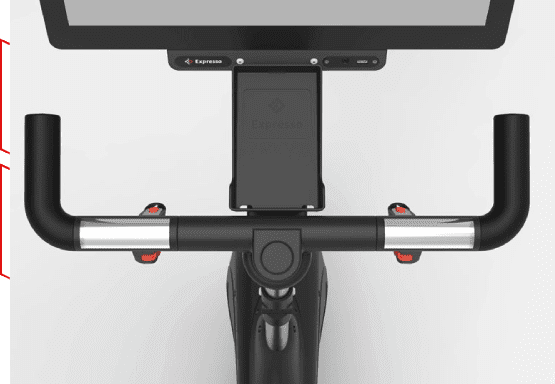 A close up of the handlebars on an exercise bike